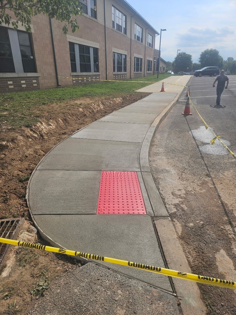 Commercial concrete sidewalk installation with ADA compliant tactile pad