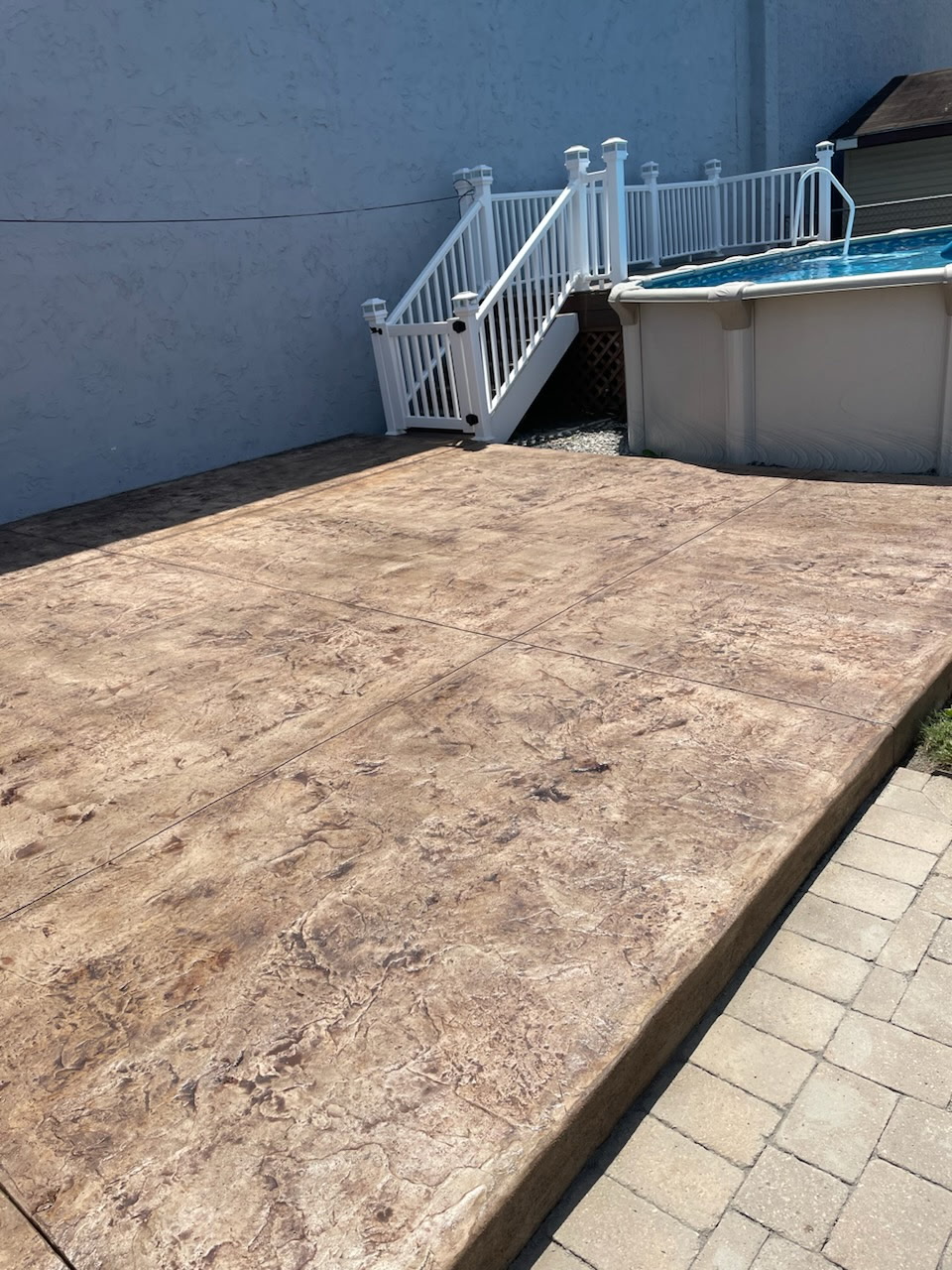 Patio after decorative stamped overlay in progress