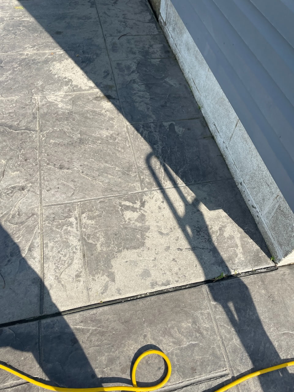 Faded paver patio before restoration